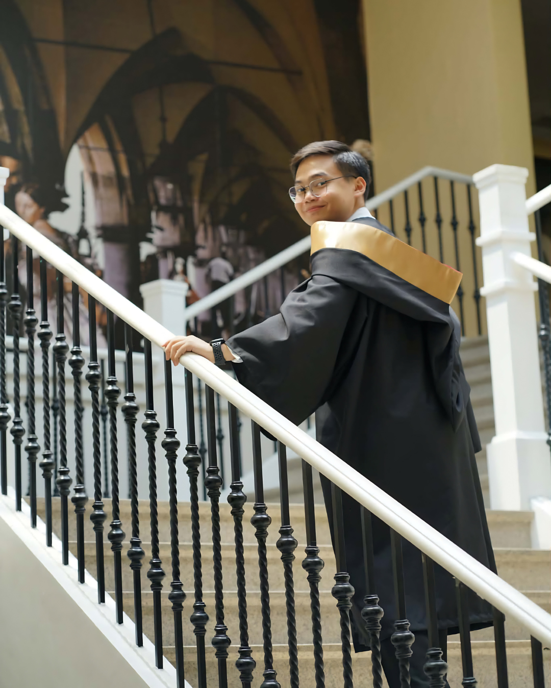 Rafael Datoc in graduation attire at Enderun